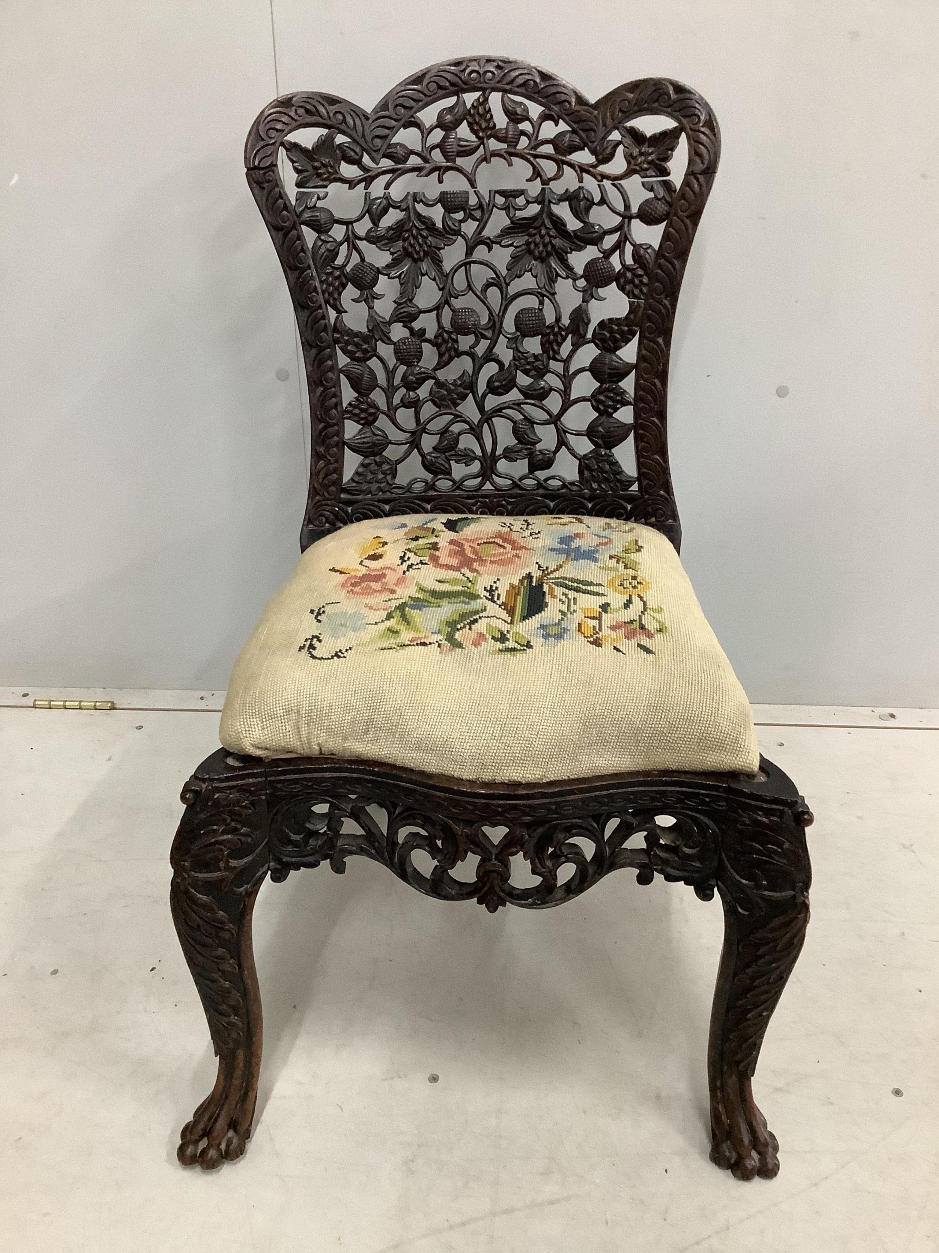 An Anglo Indian carved hardwood side chair with tapestry seat, height 81cm